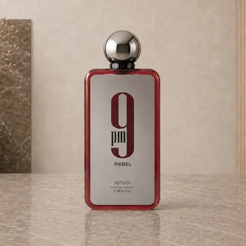 Red-edged 100 ml Afnan 9PM Rebel Eau de Parfum bottle with spherical cap