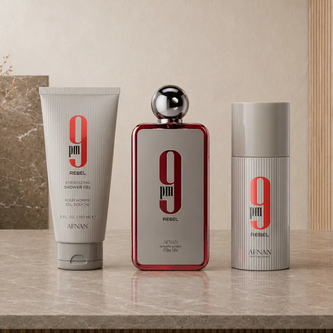 Three-piece Afnan 9PM Rebel set with shower gel, Eau de Parfum bottle and deodorant spray