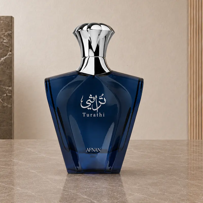 Afnan Turathi Blue navy glass bottle shown upright from the front with its silver cap.