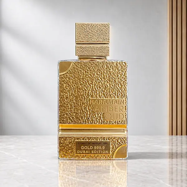 Front view of Al Haramain Amber Oud Gold Dubai Edition bottle with textured gold detailing and a square cap.