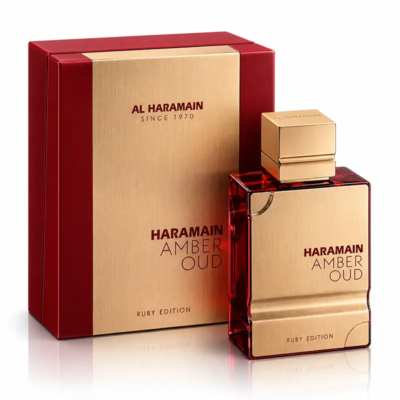 Al Haramain Amber Oud Ruby Edition bottle and matching box on a white background with reflection.