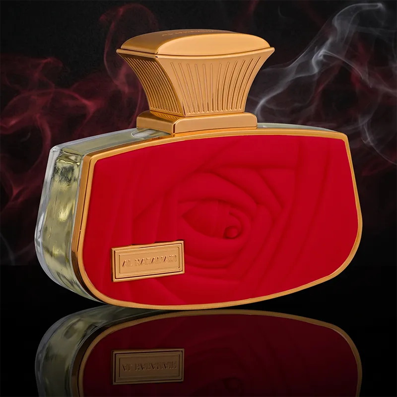Al Haramain Belle Rouge women's perfume bottle featuring a luxurious red embossed rose design and gold accents.