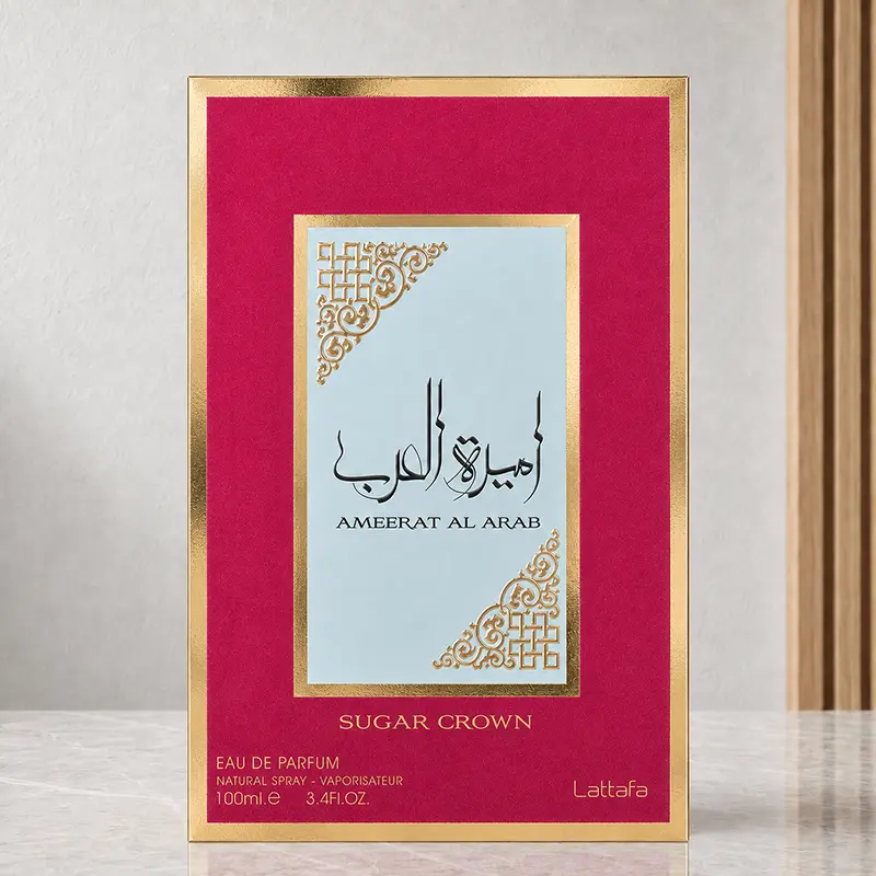 Ameerat Al Arab Sugar Crown box with a pink front, pale blue panel, gold-coloured border and 100 ml marking.