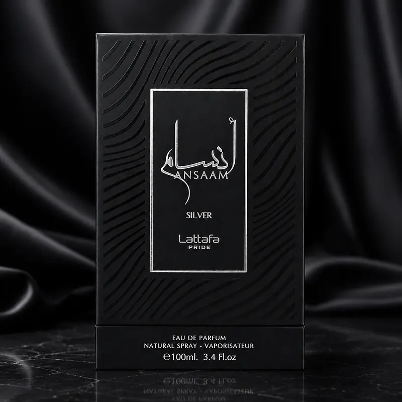 Front view of the black textured outer box featuring a central silver label border with Arabic and English branding.