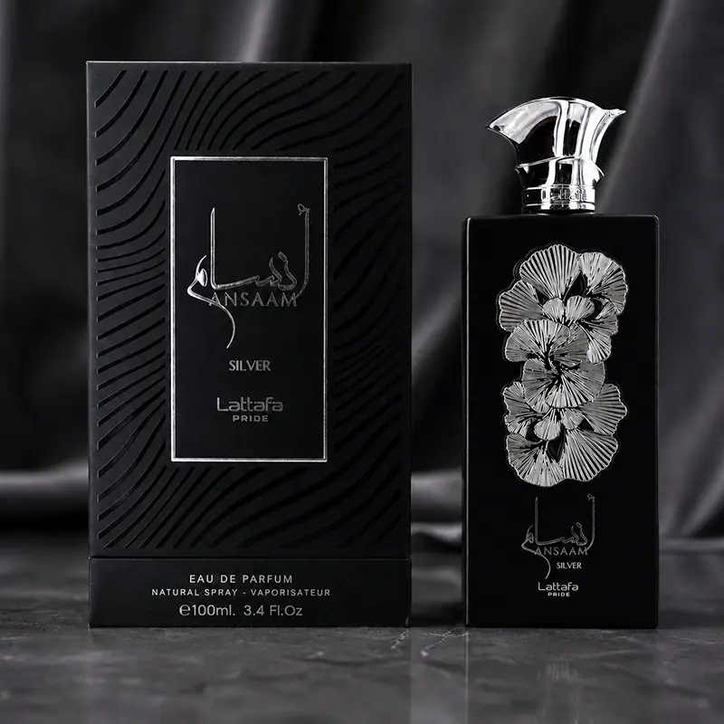 Distinctive black textured box standing side-by-side with the matching silver-engraved Lattafa Pride perfume bottle.