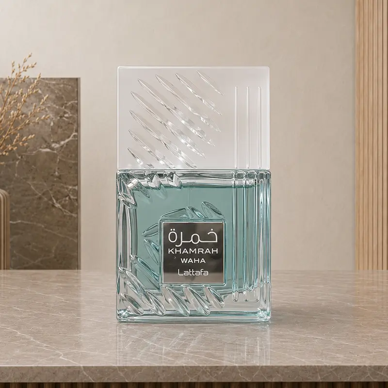 Aqua textured Khamrah Waha perfume bottle standing front-facing with its frosted patterned cap.