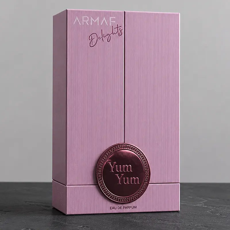 Close-up of the luxurious velvet inner packaging securing the Armaf Delights Yum Yum bottle.