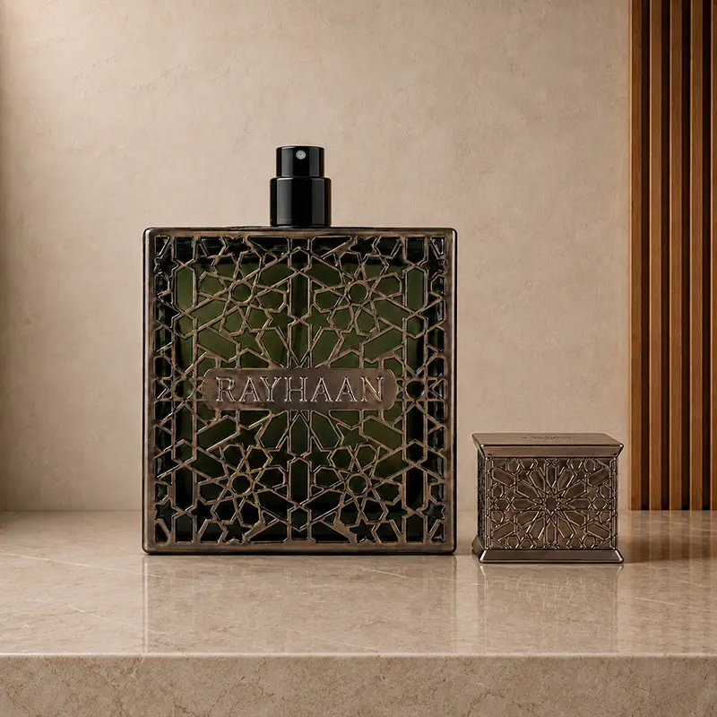 Rayhaan Terra bottle with cap removed, showing the black two-step atomiser beside the ornate green bottle.