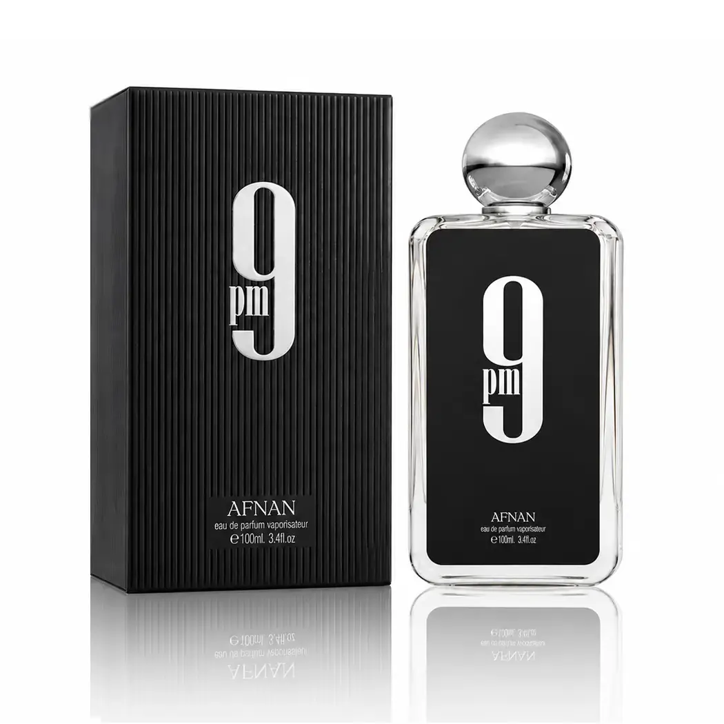 Premium Afnan 9 PM parfum bottle with luxury packaging in a clean commercial hero composition.