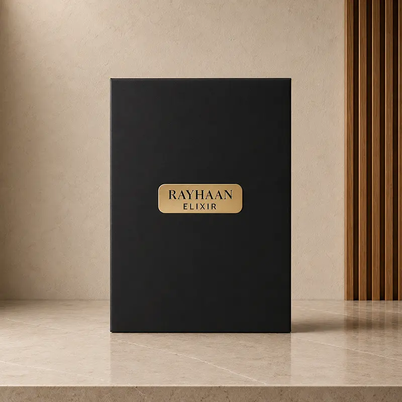 Black Rayhaan Elixir inner box shown from the front with a small gold nameplate.