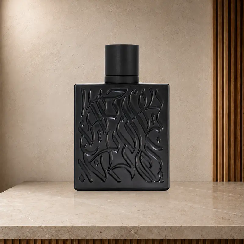 Rear of the black Rayhaan Tiger bottle showing a raised abstract pattern and cylindrical cap.