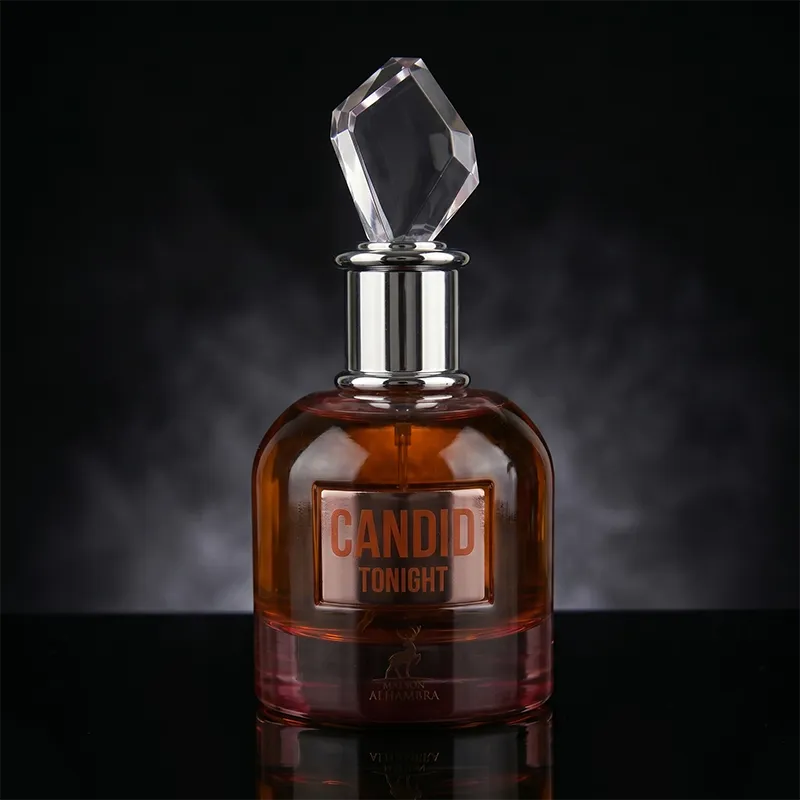 Close-up of Maison Alhambra Candid Tonight women's perfume bottle with amber liquid and crystal-style cap.