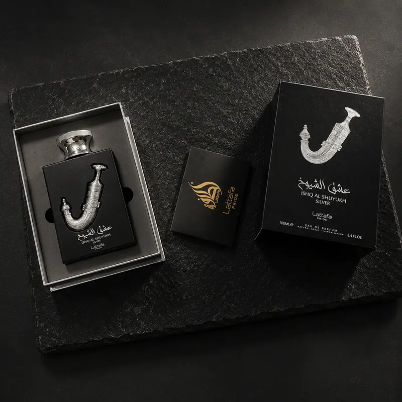 Top-down unboxing experience revealing the inner presentation, luxury box, and guide book of this niche fragrance.
