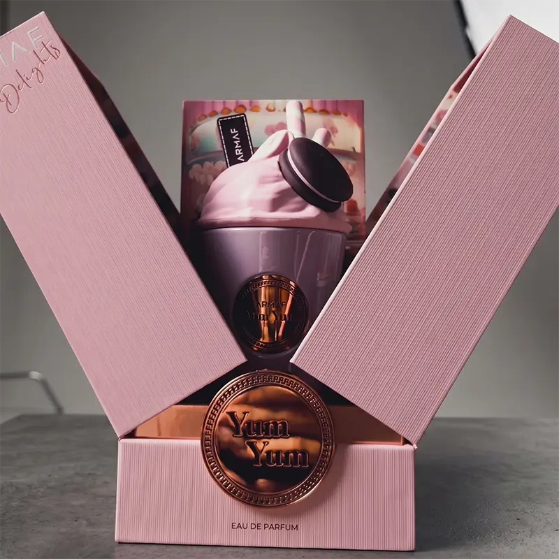 Elegant unboxing reveal of the Delights Yum Yum perfume, highlighting its premium presentation.