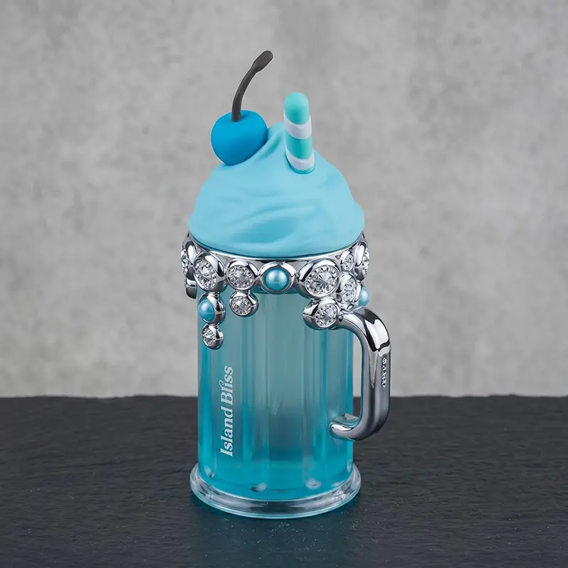 Closeup view of the jeweled blue Armaf Island Bliss bottle with polished metallic detailing.