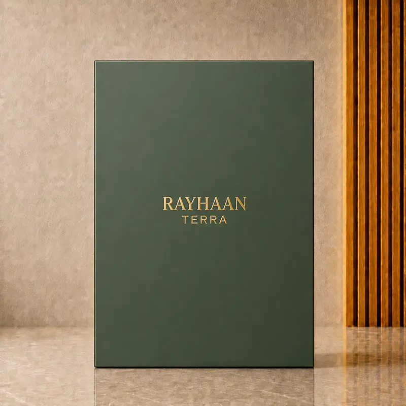 Plain deep green Rayhaan Terra inner box with centred gold RAYHAAN TERRA lettering in the studio.
