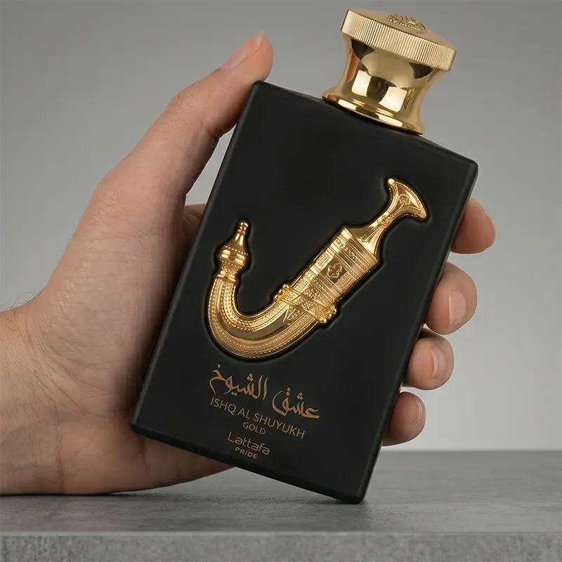 Arabian luxury discover: Lattafa Ishq Al Shuyukh Gold held in hand showing the elegant bottle scale.