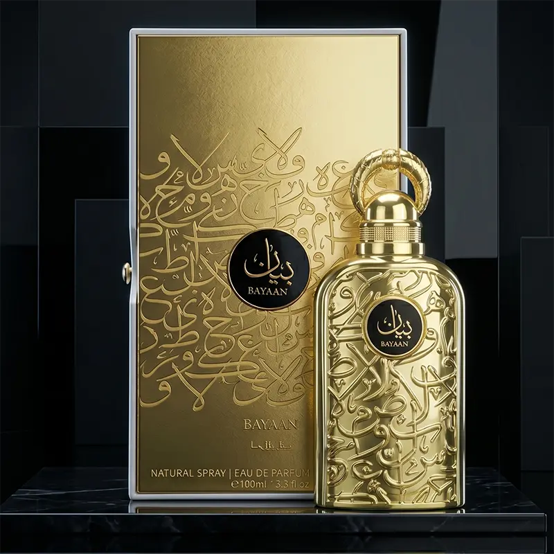 Elaborate gold outer packaging and distinctive perfume bottle of Lattafa Bayaan showcasing Arabic calligraphy.