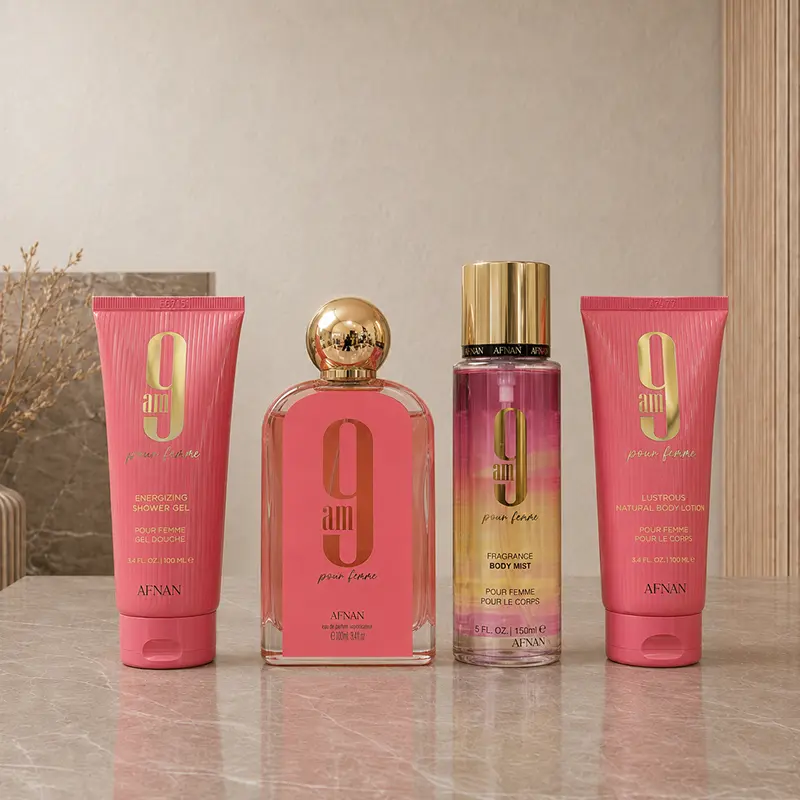 Four Afnan 9 AM Pour Femme products arranged together: EDP, body mist, lotion and shower gel