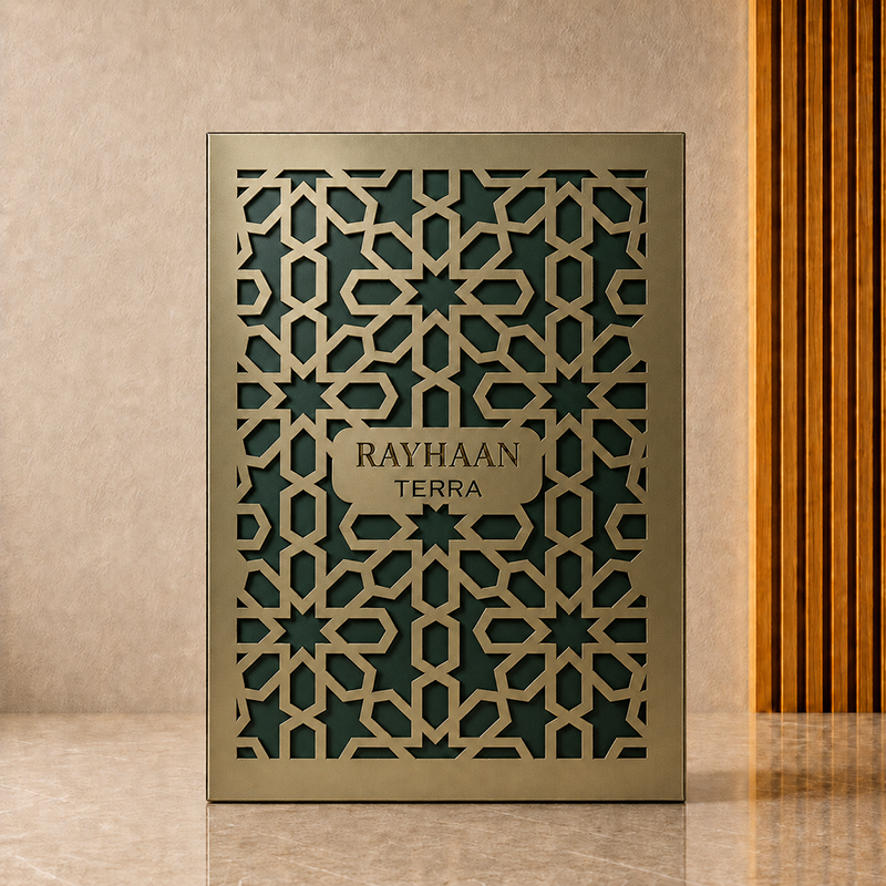 Rayhaan Terra outer box in full front view with deep green backing and a brass-toned geometric paper lattice.