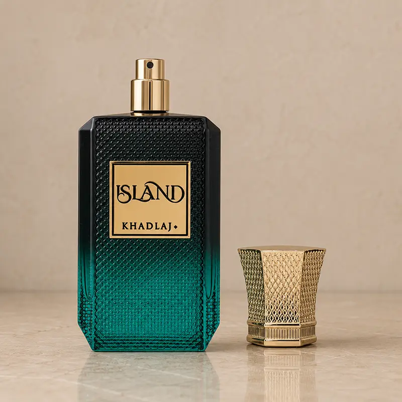Khadlaj Island bottle with gold atomiser exposed and the textured cap placed beside it.