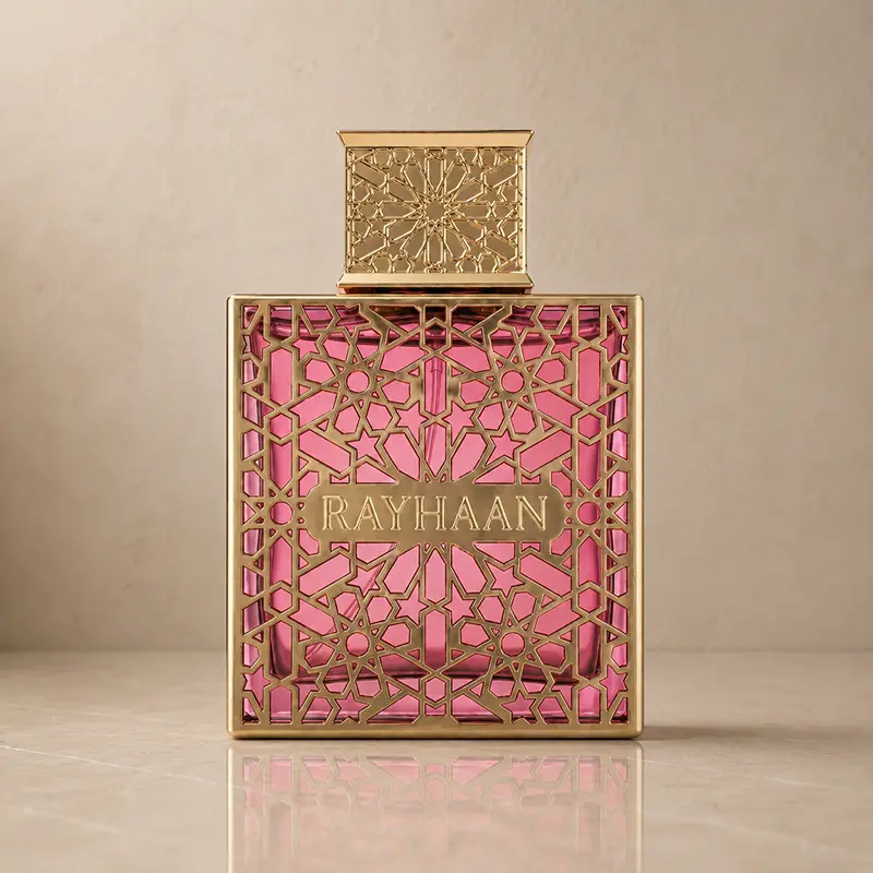 Rayhaan Kiss bottle in front view with gold lattice detailing and a pink interior.