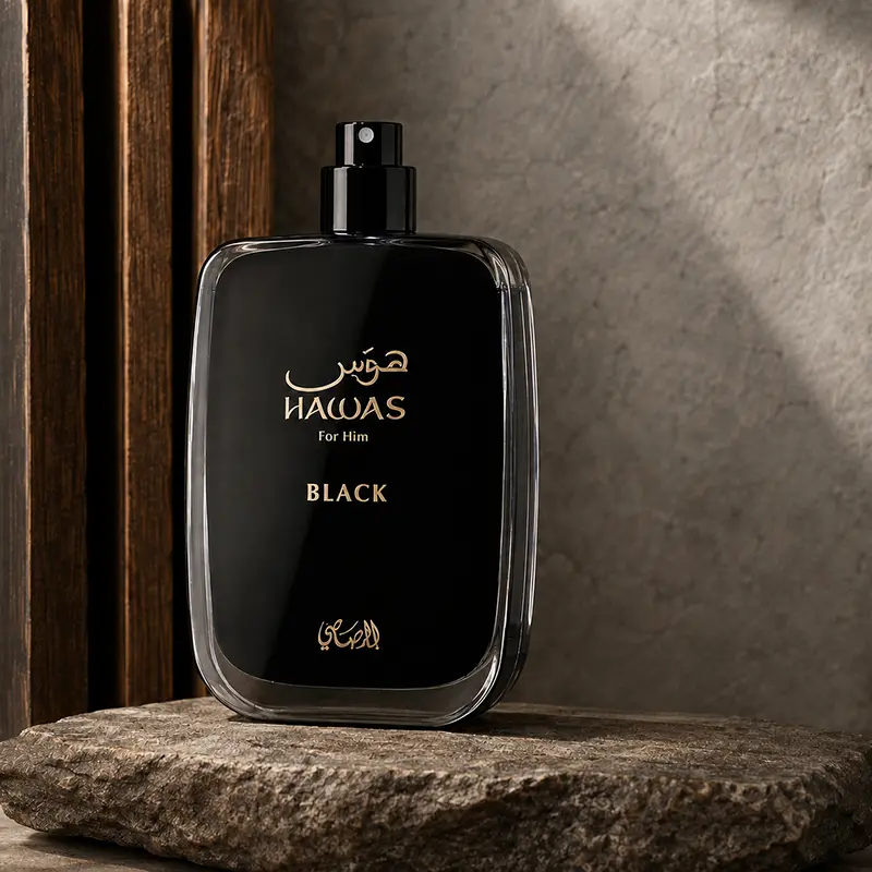 Hawas Black bottle without its cap, showing the spray nozzle in a dark studio setting.
