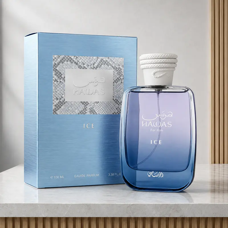 Rasasi Hawas Ice box and blue bottle shown together at an angle in the gallery studio.