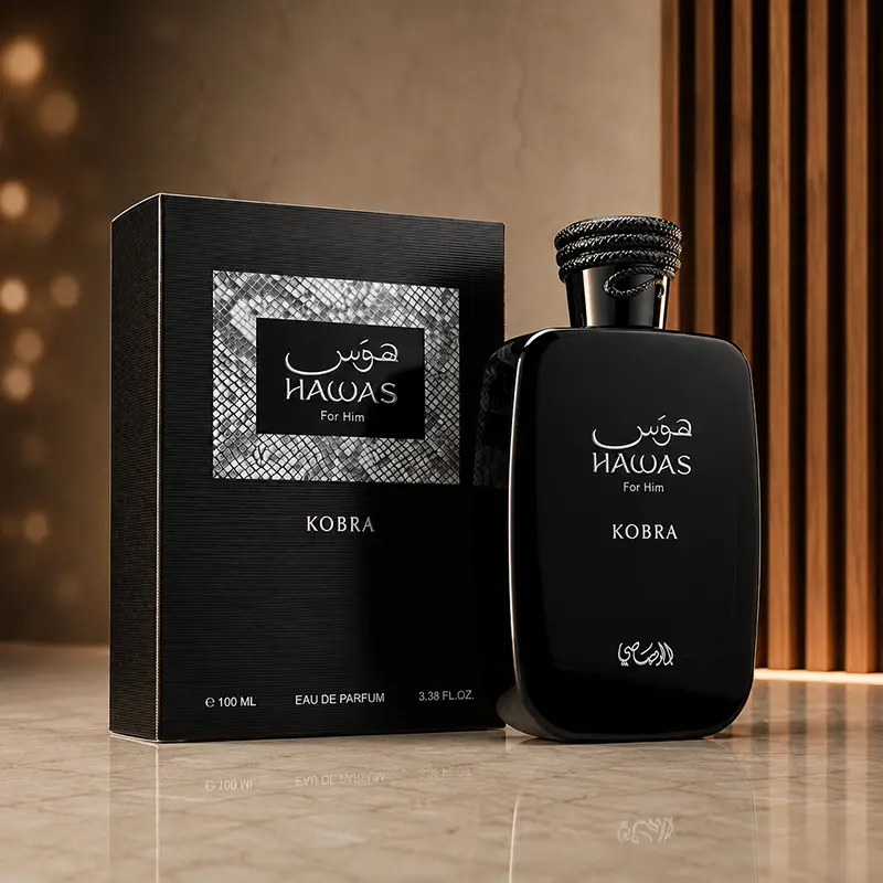 Rasasi Hawas Kobra bottle and box photographed together in a warm studio setting.