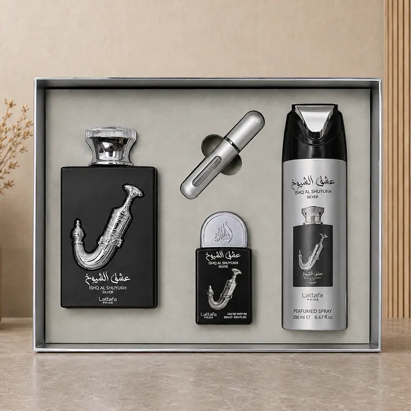 Open Ishq Al Shuyukh Silver gift set showing perfume bottles, perfumed spray and silver travel atomizer.