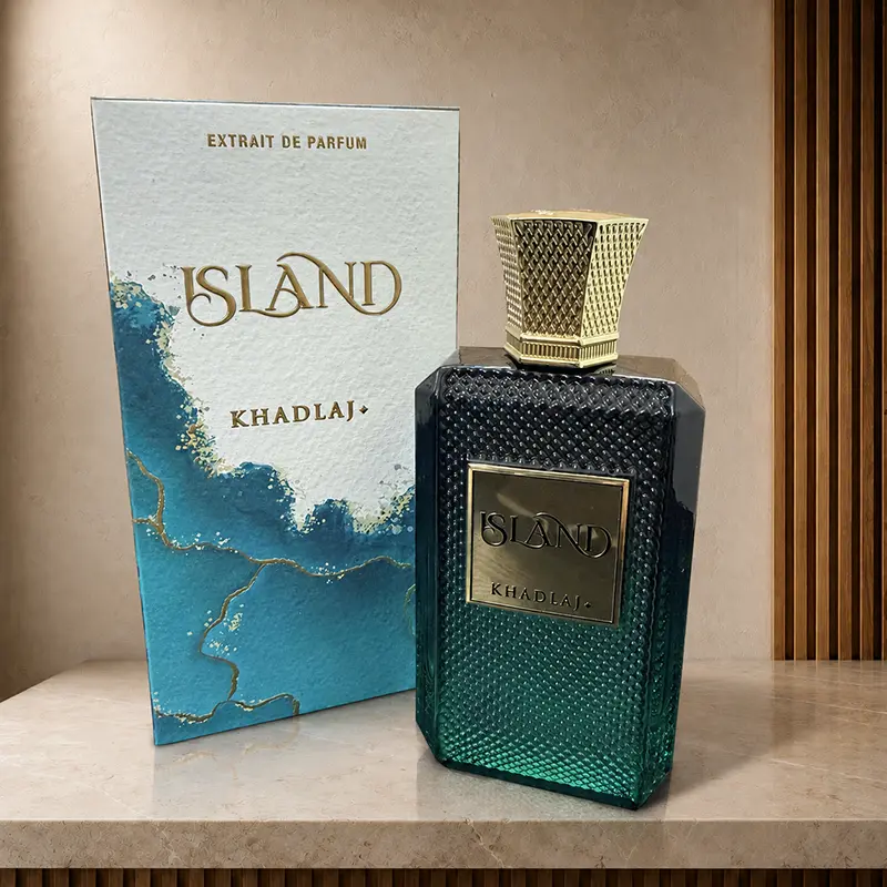 Khadlaj Island box and bottle arranged at an angle on a warm studio surface.