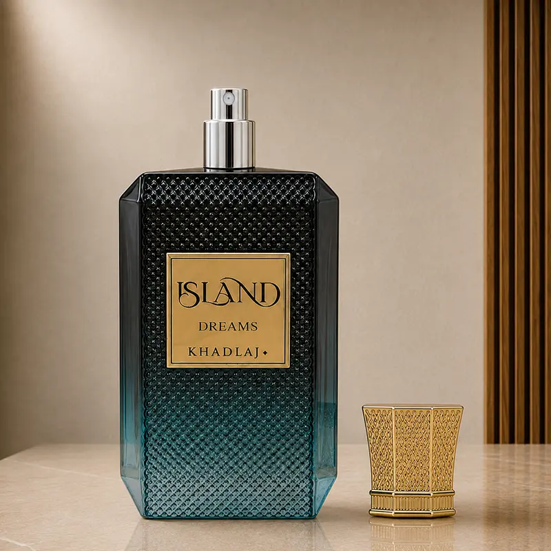 Khadlaj Island Dreams bottle with cap removed, showing the silver atomizer and gold cap beside it.