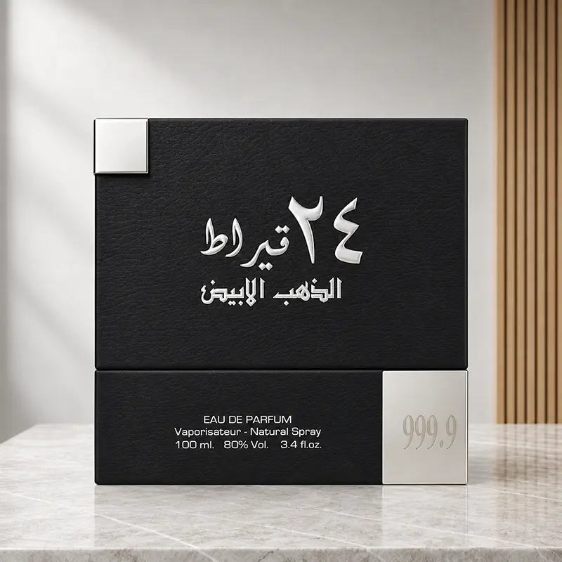 Front of the black 24 Carat White Gold 100ml perfume box with Arabic lettering and a silver 999.9 corner detail.