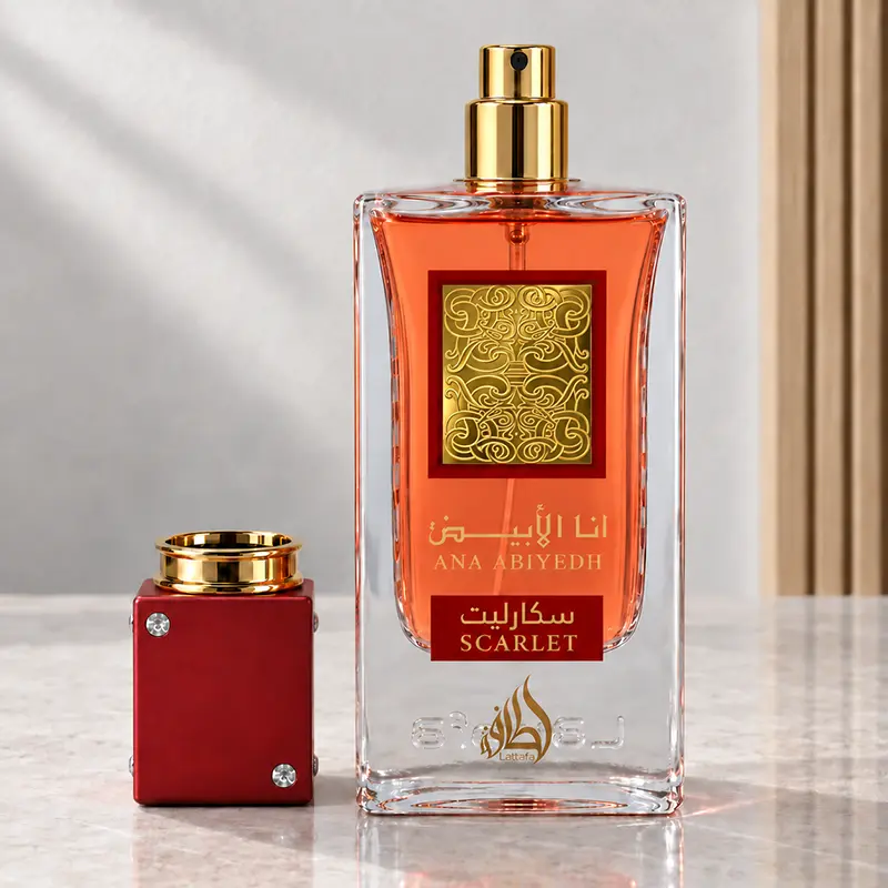 Ana Abiyedh Scarlet bottle with a gold atomizer and red cap placed beside it.