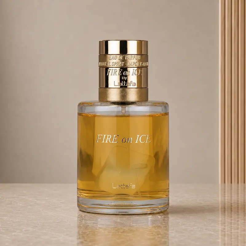 Front view of the Lattafa Fire On Ice bottle with amber liquid, clear glass and gold cap.