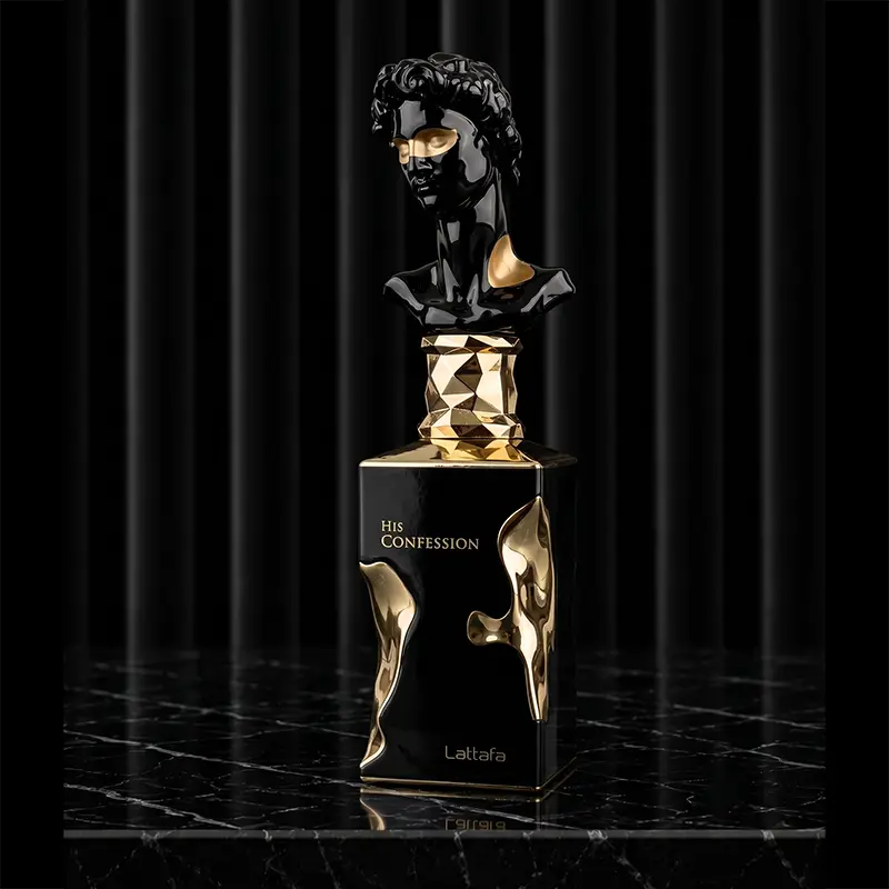 Dark textured glass flacon of His Confession perfume with its distinct sculptural silver tone cap.