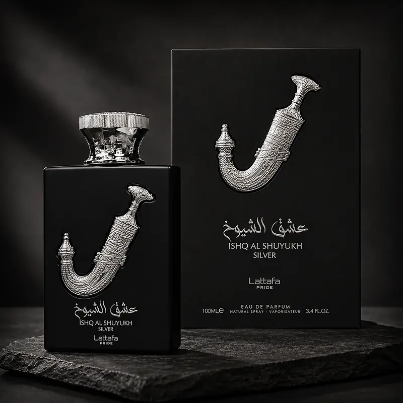Authentic Lattafa Ishq Al Shuyukh Silver 100ml Eau de Parfum displayed alongside its elegant black and silver box.
