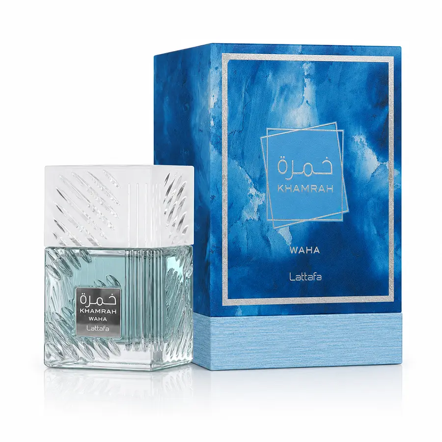 Lattafa Khamrah Waha perfume bottle with frosted cap beside the blue presentation box on white.