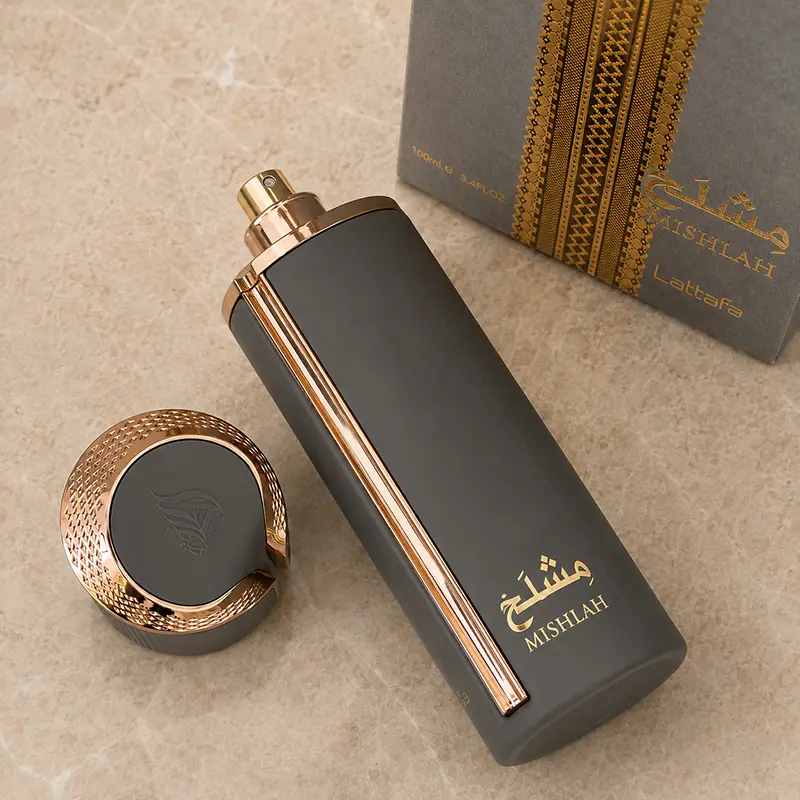 Mishlah bottle uncapped beside its cap and box, with the spray nozzle visible.