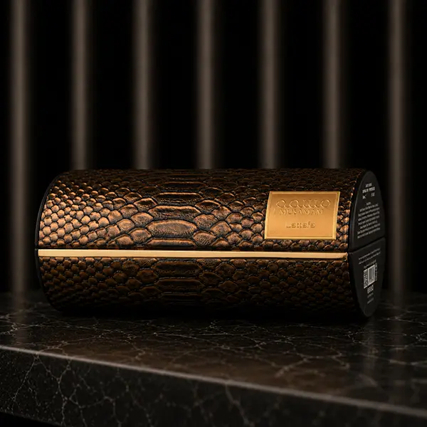 Packaging craftsmanship featuring the textured Musamam case with embossed decorative finish.