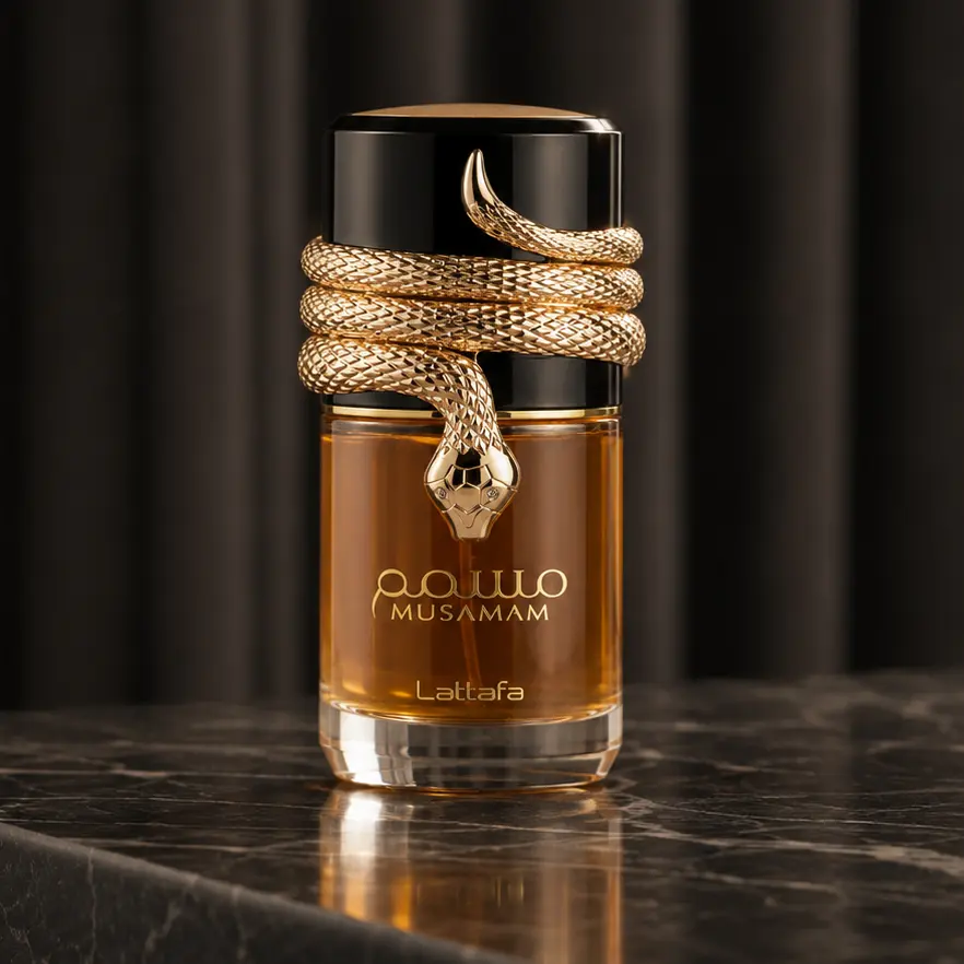 Musamam bottle displaying its gold serpent cap detail and amber fragrance body in a refined studio setup.