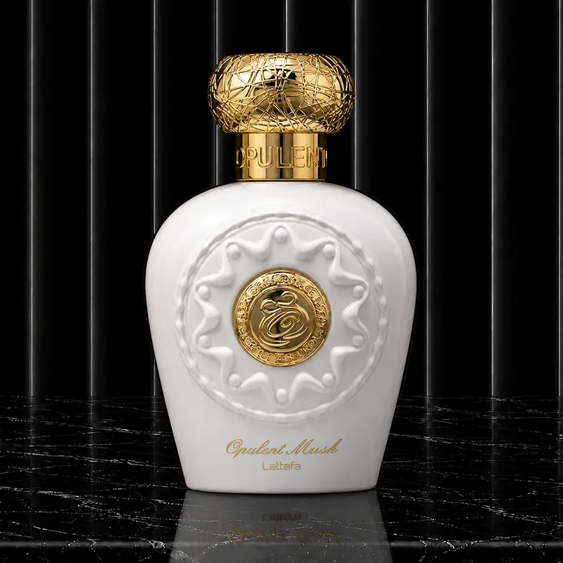 Detailed shot of the geometric white perfume flacon highlighting its heavy metallic structural build.