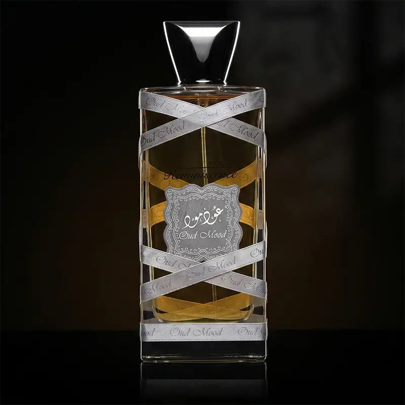 Lattafa Oud Mood Reminiscence for men, featuring a luxury glass bottle with silver ribbon accents and woody spicy notes.