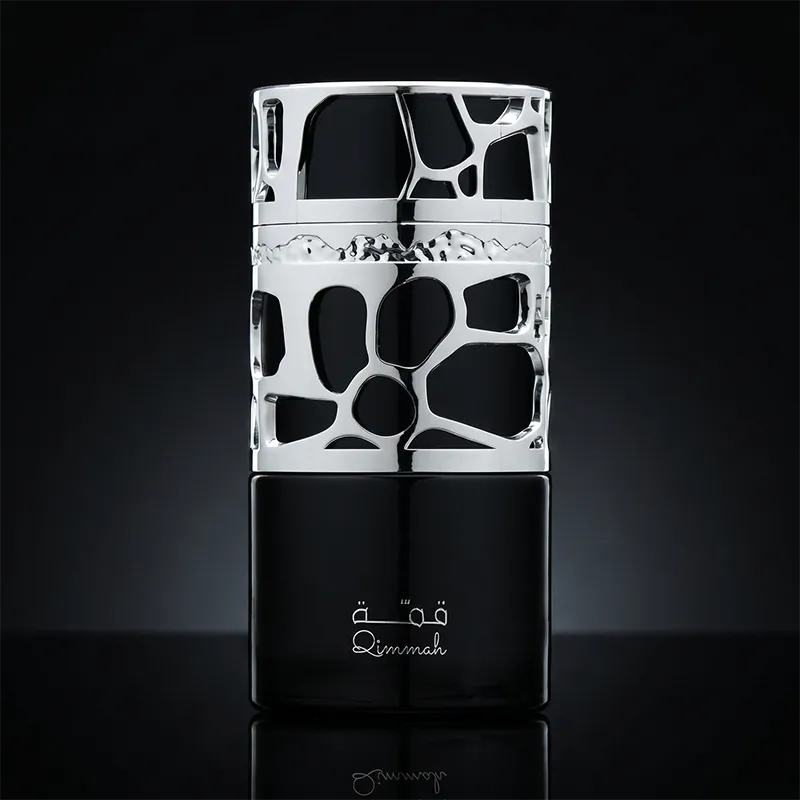 Lattafa Qimmah for Men perfume bottle featuring silver filigree design and 100ml agarwood fragrance.