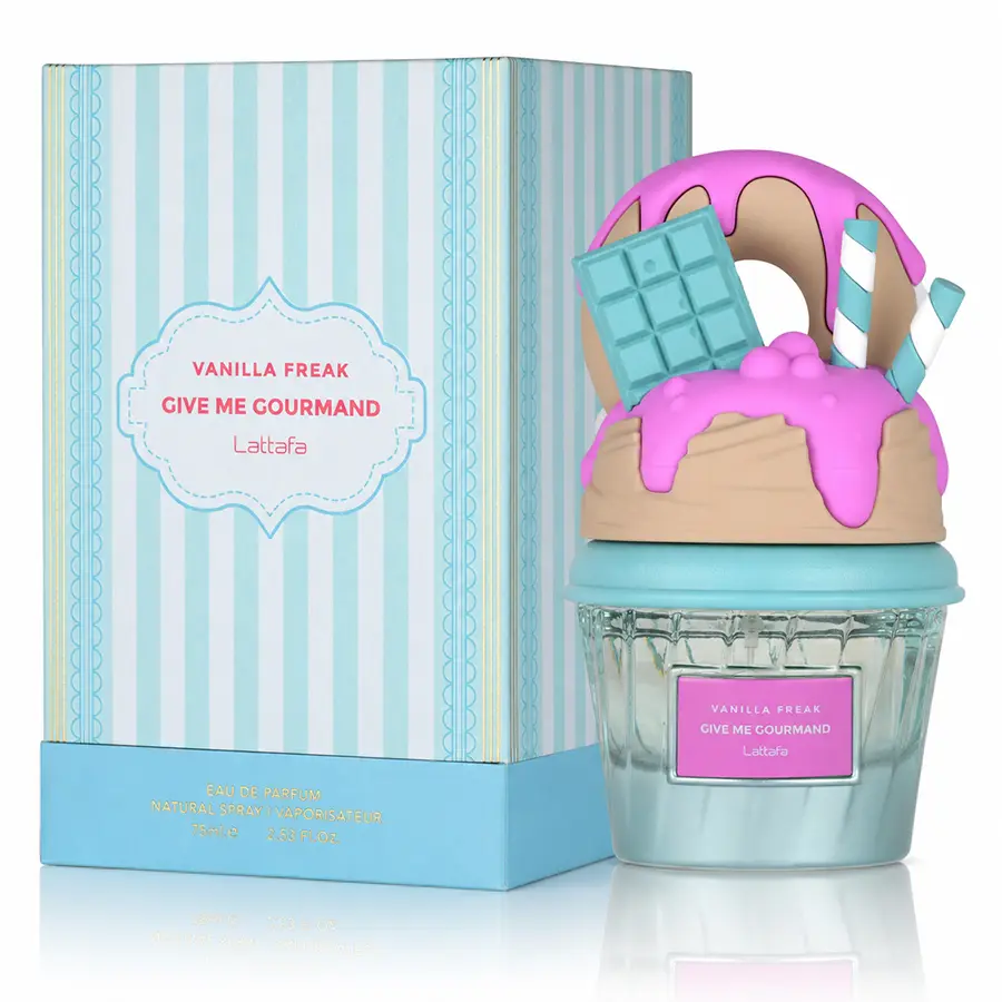 Vanilla Freak perfume bottle beside its striped Give Me Gourmand box on white.