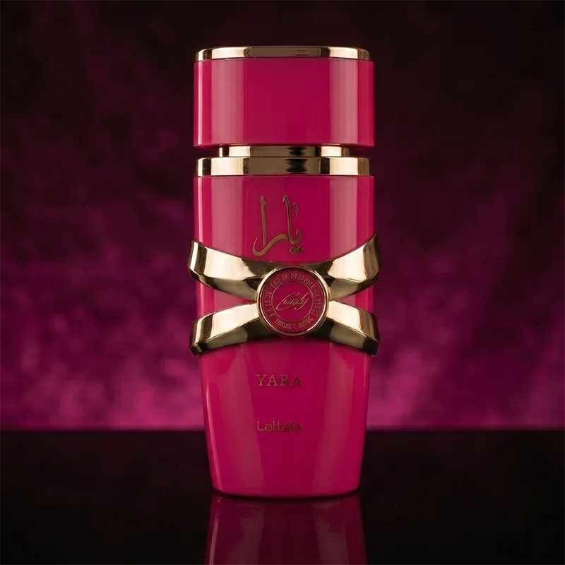 Close-up of Lattafa Yara Candy women's perfume bottle with elegant gold accents and pink sugared-fruit fragrance design.