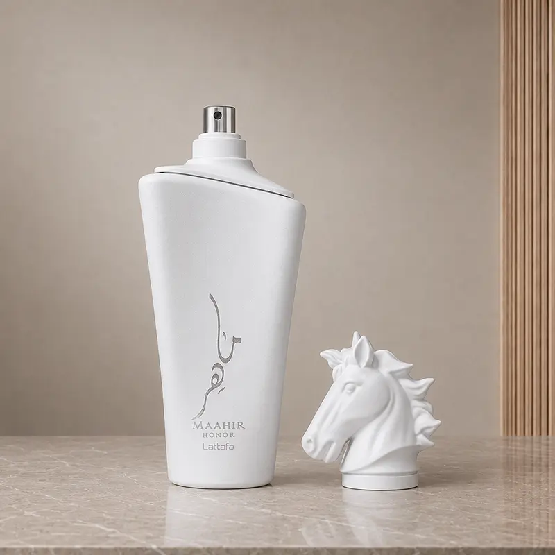 Atomiser exposed on the Maahir Honor bottle beside its detached sculpted horse-head cap.