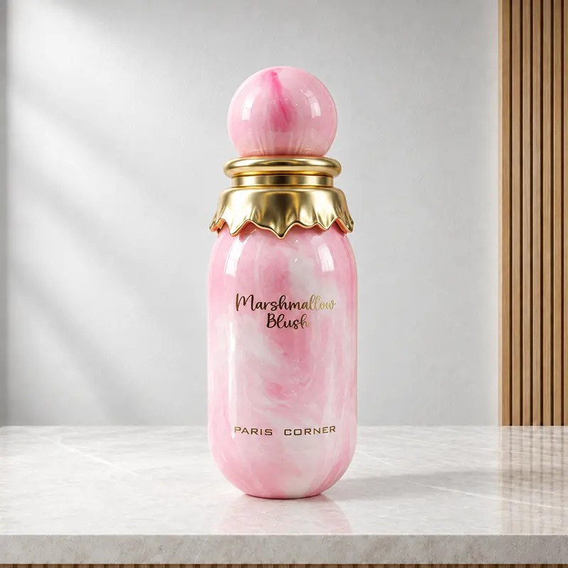 Front view of the pink marbled Marshmallow Blush bottle with a spherical cap, gold collar and gold lettering.