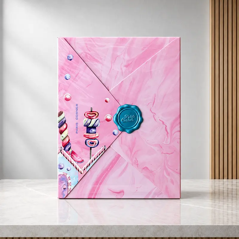 Back of the Marshmallow Blush box with pink envelope-style folds, candy artwork and a blue Paris Corner seal.