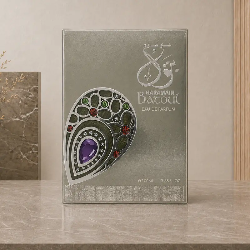 Metallic Batoul Eau de Parfum box with Arabic calligraphy, a jewelled motif and visible 100ml marking.